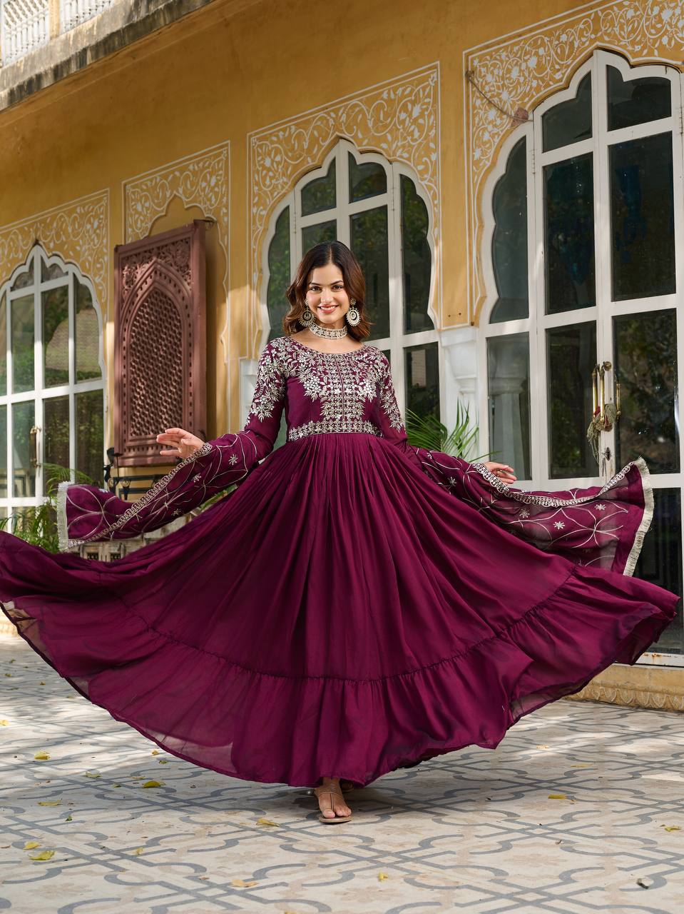 "Wine Purple Embroidered Anarkali Gown with Net Dupatta – Graceful Ethnic Wear for Festive & Wedding Celebrations"