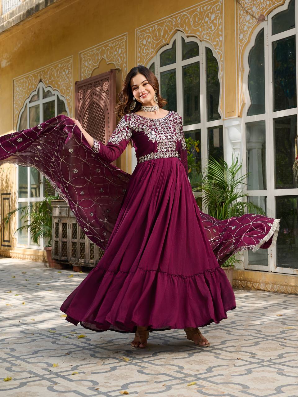 "Wine Purple Embroidered Anarkali Gown with Net Dupatta – Graceful Ethnic Wear for Festive & Wedding Celebrations"