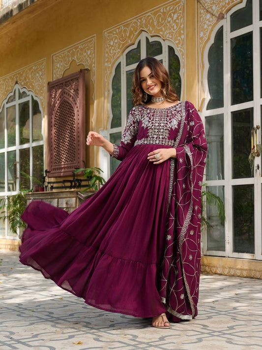 "Wine Purple Embroidered Anarkali Gown with Net Dupatta – Graceful Ethnic Wear for Festive & Wedding Celebrations"
