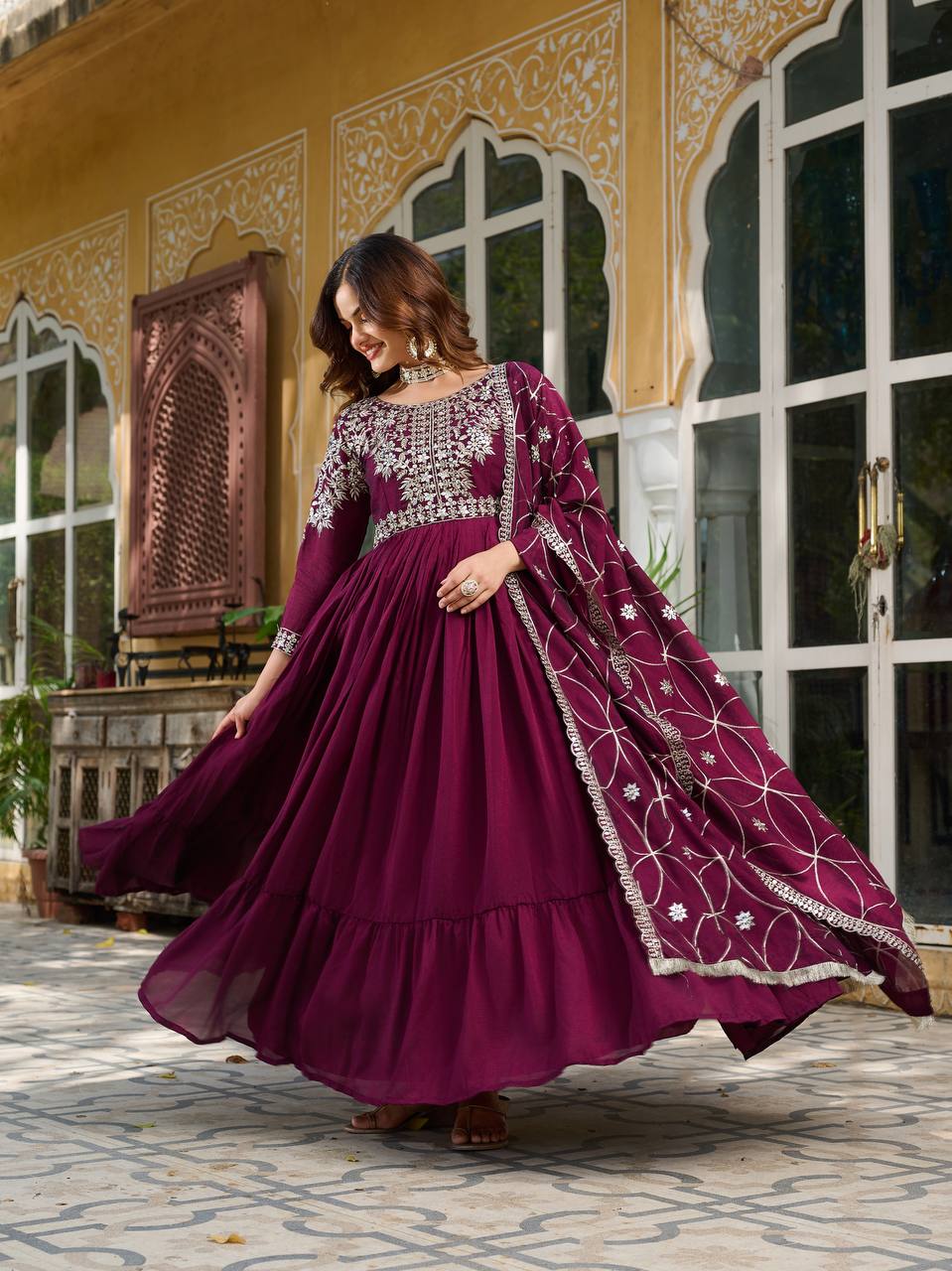 "Wine Purple Embroidered Anarkali Gown with Net Dupatta – Graceful Ethnic Wear for Festive & Wedding Celebrations"