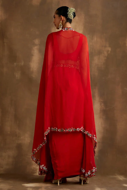 Red draped skirt with embroidered crop top & cape